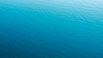 The image shows a tranquil water surface with gentle ripples.