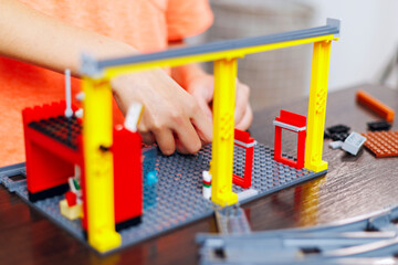 Child Building with Colorful Toy Construction Set