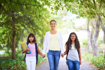 Mother, daughter and holding hands outdoor for school with portrait, happiness and backpack or books. Family, woman and children in park with support for education, learning and parenting with love