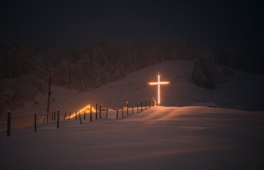 Lit up cross in the night