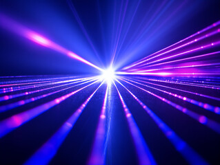 Fototapeta na wymiar Blue and violet beams of bright laser light with black background.