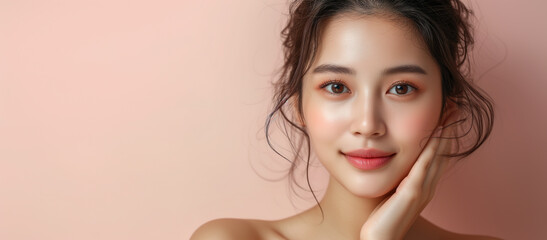 Natural beauty. Young woman with a glowing complexion and a natural makeup look, showcasing flawless skin and a gentle touch to her face - obrazy, fototapety, plakaty