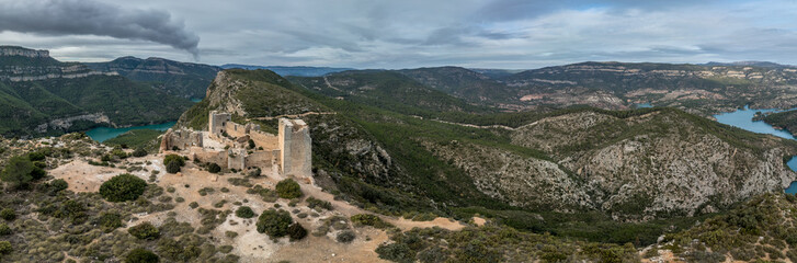 Aerial view of 15th century medieval castle ruin Castillo de Chirel in Spain above the Jucar river with partially restored walls and towers, great hiking place