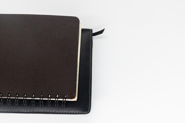 notebook on white background with clipping path writing in spiral notepad on isolated