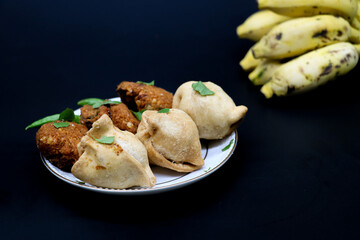 Samosa or singara.Traditional food isolated on black background,