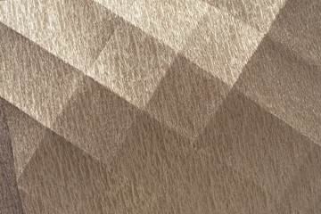 creased crepe paper with checkered pattern (formed by crease lines) with variable highlights