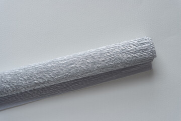 Fototapeta premium rolled crepe paper isolated on blank paper