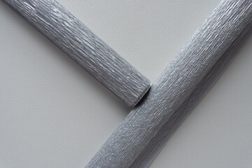 two metallic silver crepe paper rolls - obrazy, fototapety, plakaty