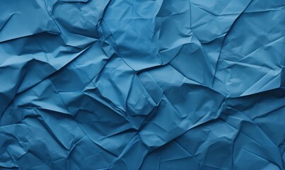 Obraz premium Blue crumpled paper background. Texture of crumpled paper.
