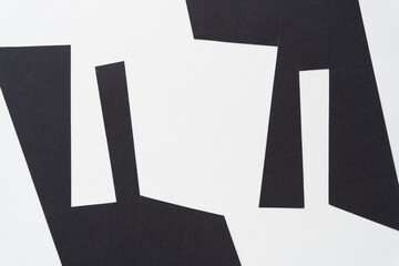 geometric abstract black paper shapes on white