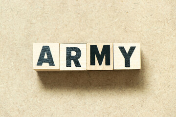 Obraz premium Alphabet letter block in word army on wood background