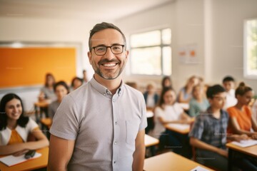 A man stands in front of a classroom full of students, presenting a lesson, Portrait of smiling teacher in a class at elementary school looking at camera, AI Generated