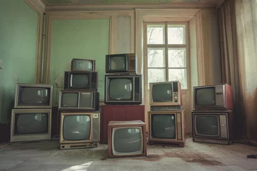 Schilderijen op glas Antique and vintage style photo. retro televisions pile on floor in old room © Dung