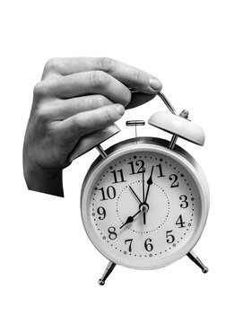 Female hand holding alarm clock through paper background. Inspiration, idea concept, trendy magazine style. art collage. It's time
