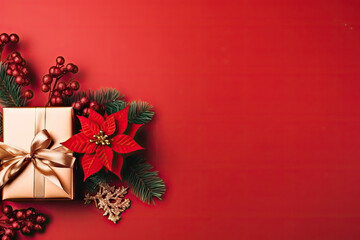 Christmas background with red poinsettia and gift box on red background
