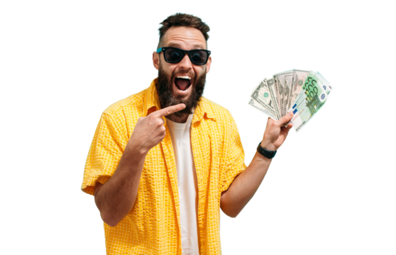 Excited happy young male winner feeling joy while holding money won, winning lottery, placing bets, getting cashback online gift. Human face emotions and betting concept.