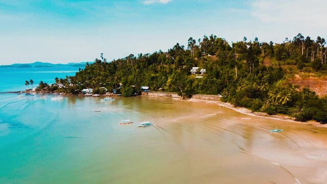 Aerial view 4k over Port Barton Harbour in Palawan, the Philippines, on a sunny morning. blue seas and skies and sunrises and misty mornings.