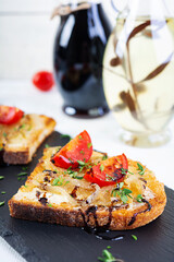 Hot sandwich with caramelized onion and cheese. Roasted bread toast