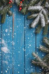 Snow and fir abstract christmas blue wooden background concept