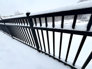 Snow covered railing