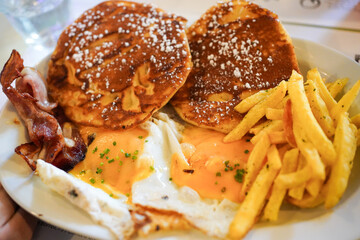 Hearty American breakfast with pancakes and bacon
