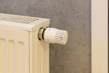 large sum of money in euros on a heating radiator. The concept of increasing prices for energy resources