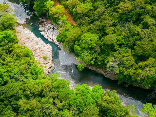 Aerial view of beautiful jungle river as secret hidden gem in Panama wilderness