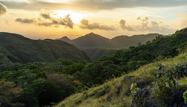Beautiful sunset on green hill of El Valle de Anton in panama with mountains and jungle in background