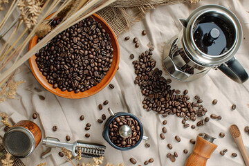 coffee beans and grinder on a table from above