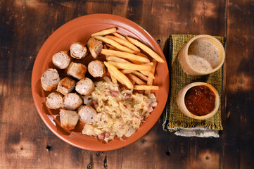 schupfnudeln French fries with sauerkraut Weisswürst white sausage typical German food