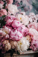 a large bouquet of pink and white flowers peonies