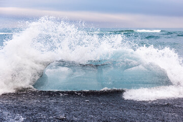 Wave breaking on the beach, diamond coast, the mystical landscape of Iceland