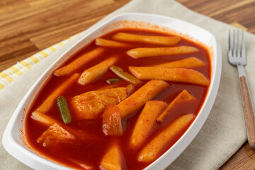 Snack, Korean food, tteokbokki, sundae, fried food, fish cake, fish cake skewers, skewers, pork liver, fried eggs, deep-fried squid, seaweed roll