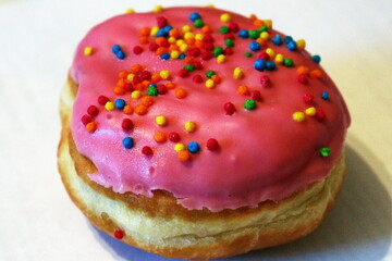 Pink bright cupcake muffin in sweet icing in the shape of a ring. Dessert food