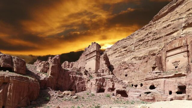 Mountains of Petra (against the background of the sunset, 4K, time lapse), Jordan, Middle East. Petra has been a UNESCO World Heritage Site since 1985 