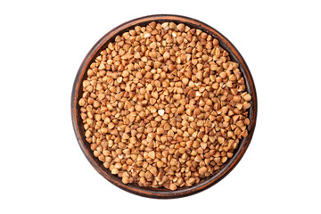 Green buckwheat grain in clay bowl isolated on white background, top view. File contains clipping path.