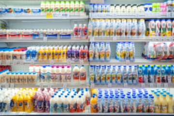 Defocused blur of supermarket shelves with dairy products