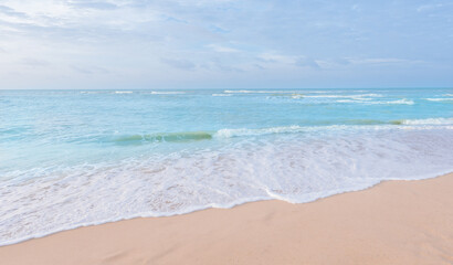 Fototapeta na wymiar Soft wave of sea. sand beach seashore with blue wave and white foamy from blue sea in summer.