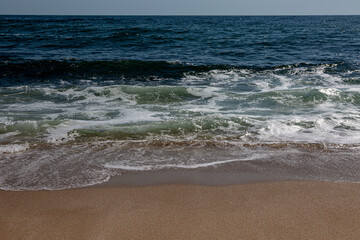 Sandy beach, waves and sea