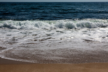 Sandy beach, waves and sea