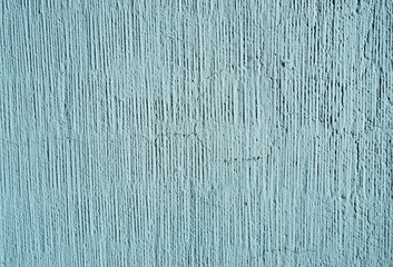 Alte verwitterte hellblaue Betonwand mit Muster als Hintergrund