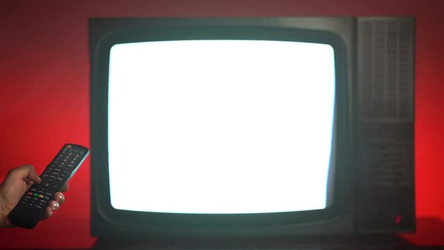 Blinking horizontal stripes and interference distortion on TV screen, old broken television on red background, person changing channels with remote control searching for better television signal