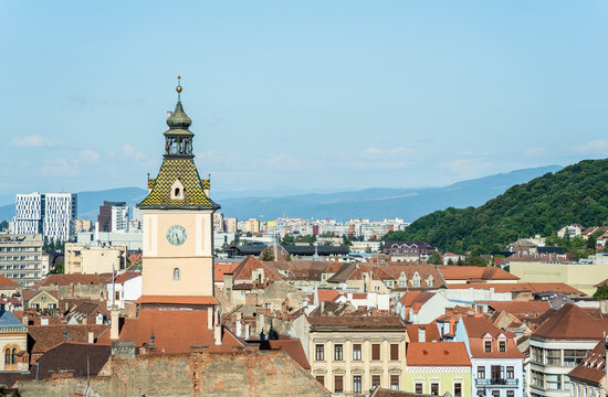 Aerial view with Brasov city hall clock tower located in the old town Council Square.