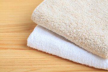 A two towels on wooden background, copy space.
