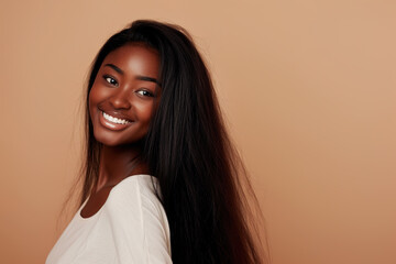 Beautiful smiling black woman with healthy shiny hair	