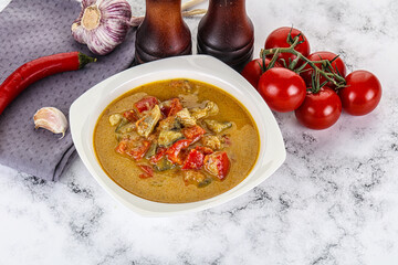 Traditional yellow Thai curry with chicken