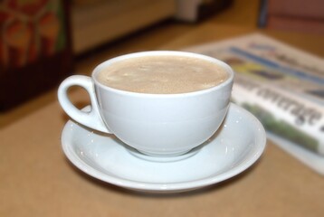 Coffee cup on the table in coffee shop