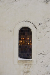 Fototapeta na wymiar Window of Hoff Medieval Stone Church, Toten, Norway.