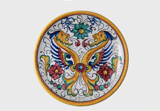 ceramic plate from deruta manufactory with Raphaelesque renaissance style decoration on white horizontal background