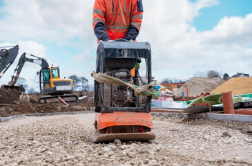 Vibrating plate compactor osed to compact ground and stone on building site